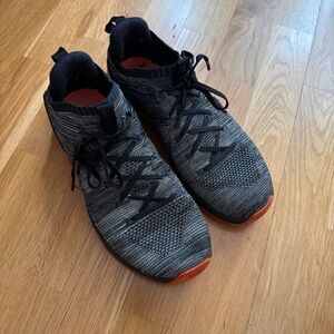 Nike Black and Gray Sneakers with Orange Accents